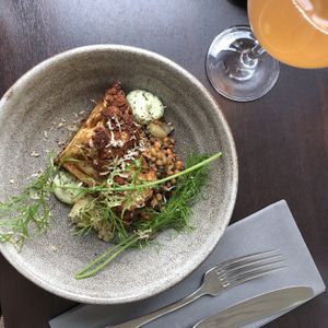 Cauliflower with a vegan majo, beluga lentils, champignons and dill at Restaurang Sand in Bastad
