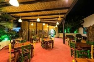 outdoor seatin area in the evening at Gecko Burger Place in Santorini