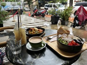 Hummus bowl, scrambled tofu, oat latte and fresh ginger drink  at Coco&Co in Vientiane