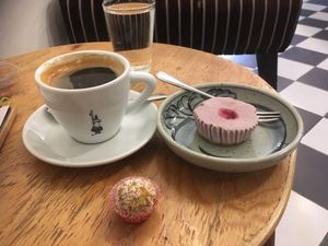Coffee, vegan raspberry cheesecake and carrot nut ball  at Coco&Co in Vientiane