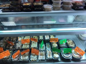 prepared food with green labels for vegan options  at Nan-yea Market in Madrid