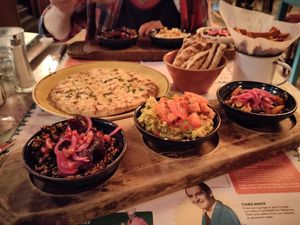 Tapas bowls: mezze grain bowl, edamame bowl, black beans & sweetcorn, with garlic flatbread and sweet potato fries at Lounges - Nautico Lounge in Weymouth