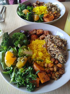 Quinoa, rice, broccoli, kale, lettuce, sweet potato, tofu, spiced chickpeas, and orange. Great bowl of goodness. at Cardamomo in Bogota