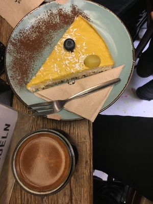 Schwarzer Kaffee mit Mango-Raw-Cake. ✨  at Hommage in Cologne