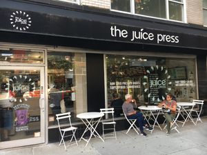 Outside of venue, with outdoor seating. at Juice Press - Lenox Hill in New York City