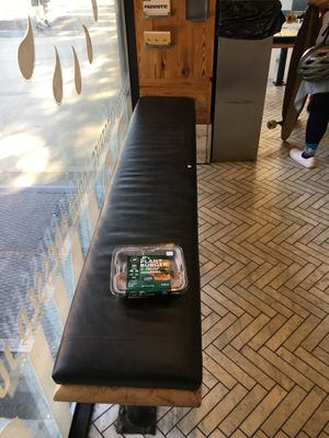 One of the two benches in this branch (the other bench is much smaller); today, I bought the plant burger to cook at home.  at Juice Press - Columbus Ave in New York City