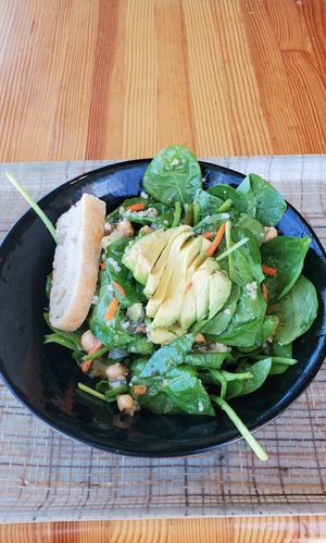 b-y-o salad with spinach, quinoa, avo, chickpeas, pineapple, carrots and mint leaves at Fork and Salad in Kihei