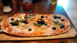 Vegan pizza with artichoke, olives, and balsamic onions. at Zizzi - Wharfside St in Birmingham