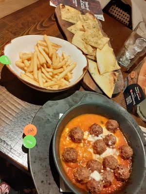 vegan garlic bread, meatless balls in sauce and chips at Zizzi in Bournemouth