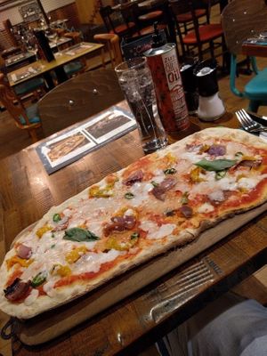 Zizzi's Vegan Rustica Margarita. Toppings: Red Onions, Green Chillies and Roasted Peppers.
Tasty enough, I'd have another one. The Green Chillies were pretty tame. The "cheese" is made with Coconut Milk. at Zizzi - Dundrum Town Centre in Dundrum