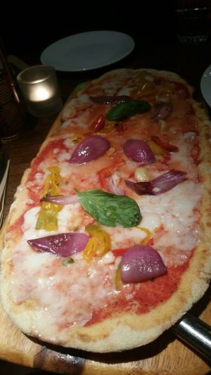 Vegan rustica Margherita pizza with added onions, peppers and garlic at Zizzi - Charlotte St in London