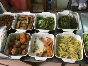 Choices of vegetables, tofu, pineapple,  at A Di Da Phat in Ho Chi Minh City