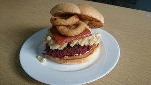 Mac and cashew cheese vegan bacon onion rings on garlic bread toasted bun at The Burger Garden in Sheffield