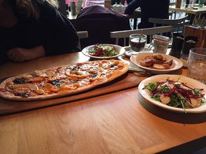 Vegan rustica pizza with butternut squash, Caramelised balsamic onions, mushrooms, garlic cloves and pine nuts  at Zizzi in Watford