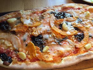 Vegan rustica pizza with butternut squash, Caramelised balsamic onions, mushrooms, garlic cloves and pine nuts  at Zizzi in Watford