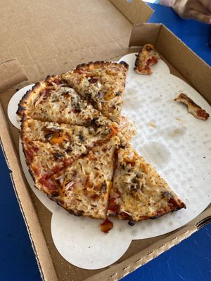 Pizza with non-dairy marinara, vegan cheese, mushrooms, bell peppers, and onions  at Silver Beach Pizza in St Joseph