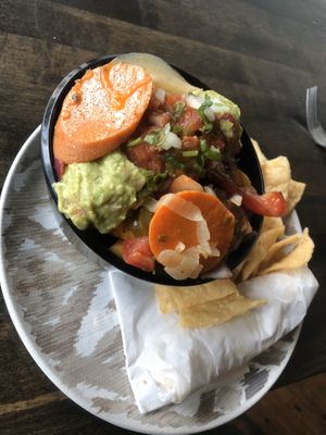 Fajita bowl with pickled veggies on top. at Mucho Mas in Michigan City