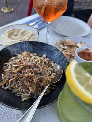 Red drink is Apericol spritz…wife liked it.  at Le Phenicia in Antibes