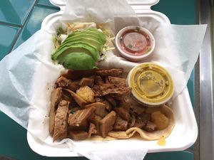 Gallitos de seitan with avocado, salsa, chips at La Esquina Vegana in Heredia