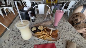 Tofu Entree, my dog, Pina colada cocktail and strawberry cocktail, just awesome, and alcohol free at La Esquina Vegana in Heredia