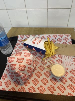 Nashville Hot burger with fries and garlic mayo  at Temple of Seitan - Hackney in East London