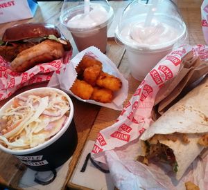 Cole slaw, döner wrap, tater tots, burger and milk shakes at Temple of Seitan - Hackney in East London