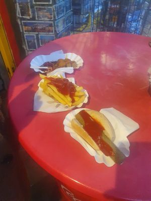 Vegan currywurst, bratwurst and chips. at Curry at the Wall - Food Stand in Berlin