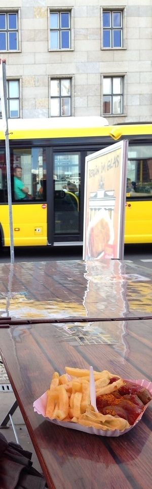 Vegan currywurst and chips at outside seating at Curry at the Wall - Food Stand in Berlin