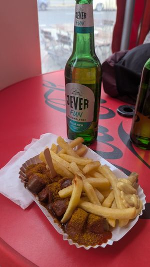 Menu with Currywurst fries and drink at Curry at the Wall - Food Stand in Berlin