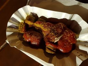 Currywurst with sauce at Curry at the Wall - Food Stand in Berlin