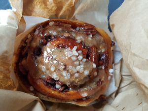 Sticky cinnamon bun bought to takeaway at Chesters by the River in Skelwith Bridge