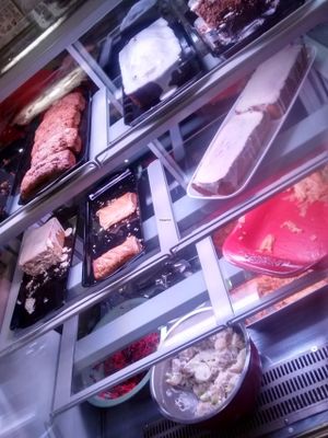 Fridge with cakes and salads and savoury dishes at Soy Division in Glasgow