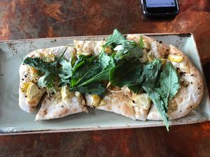 Kale and artichoke flatbread (ordered vegan without the ricotta) at Pelican Pub & Brewery in Pacific City