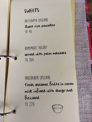 Two desserts are labelled vegan  at Jatra Biroti in Dhaka
