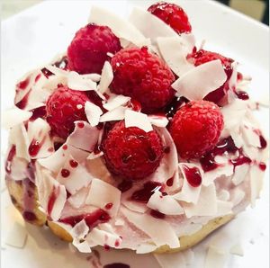 Raspberry Frosting, Raspberries, Coconut, Almonds & Raspberry Jam! at Cinnaholic - Grand Canyon Dr in Las Vegas