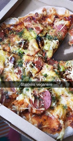 Mathias with vegan cheese and vegan pepperoni  at Bella Sydhavn Pizzeria in Copenhagen