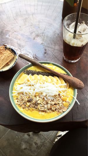Banana mango smoothie bowl & iced coffee  at Rosie's Cafe in Hoi An