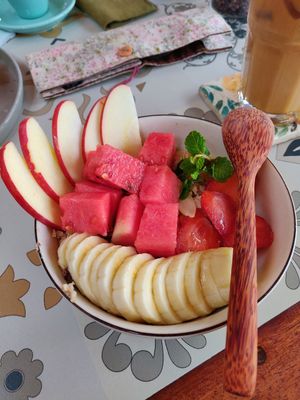 Warm oatmeal with coconut milk and cinnamon, topped with fruit at Rosie's Cafe in Hoi An