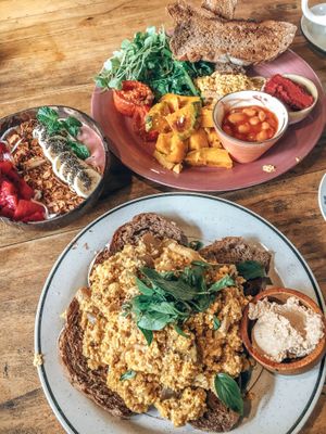 Tofu scramble with quinoa, greens and beans, banana strawberry peanut smoothie bowl at Rosie's Cafe in Hoi An