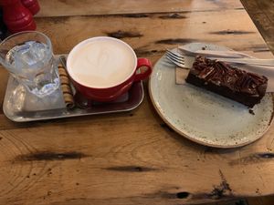 Chai latte and pecan brownie  at Pot Kettle Black in Manchester