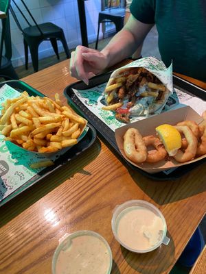 fries and onion rings at What The Pitta in London