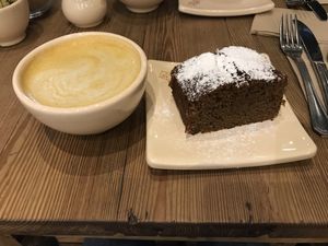 Turmeric latte (or should I say bowl!) and carrot cake. Divine! at Le Pain Quotidien - Vicente Lopez in Buenos Aires