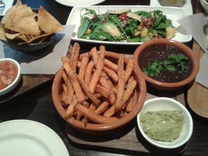 Fiesta ensalada (as a tapa), refried beans, totopos & sweet potato fries. at Las Iguanas in Torquay