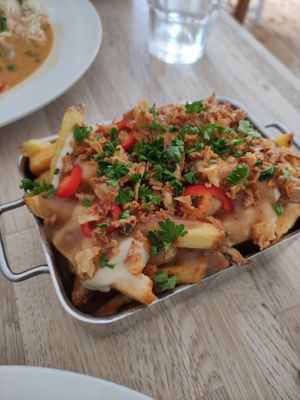 Chips with gravy, 'cheese' and crispy onion (poutine) at The Cornish Vegan in Truro