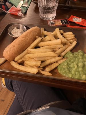 Battered banana blossom, mushy peas, skin on fries and vegan tartare sauce makes a convincing fish n chips  at The Cornish Vegan in Truro