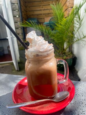 Iced oat mocha with cream and chocolate powder!  at The Cornish Vegan in Truro
