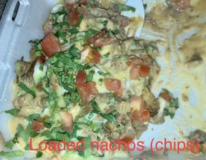 Loaded nachos with chips at El Palote Panaderia in Dallas