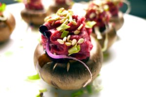 Raw marinated brown mushroom with beetroot hummus at Quinoa3 in Fuengirola