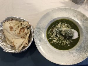 Kofta palak with vegan garlic naan  at Masala Citi in Kaunas