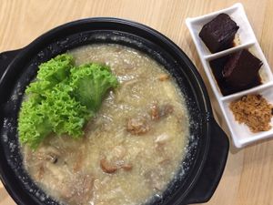 Millet porridge. In the bowl: beancurd sheets, lettuce, a variety of mushrooms (monkey head, oyster, enoki). On the side: firm tofu, ground pumpkin. Only available here! at Yuan Xiang Veggie Kitchen 圆香蔬巧 in Central Singapore